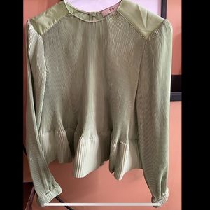 Tibi blouse, in pale green.
